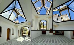 Installation of a glass dome in a former lightwell, along with a black steel door and new tiled flooring.